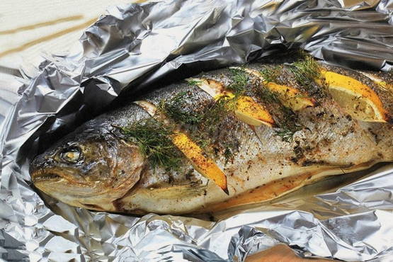Pink salmon in foil on the grill