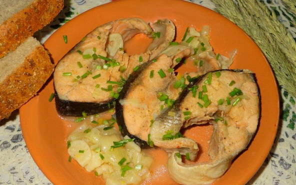 Pink salmon stewed with carrots and onions