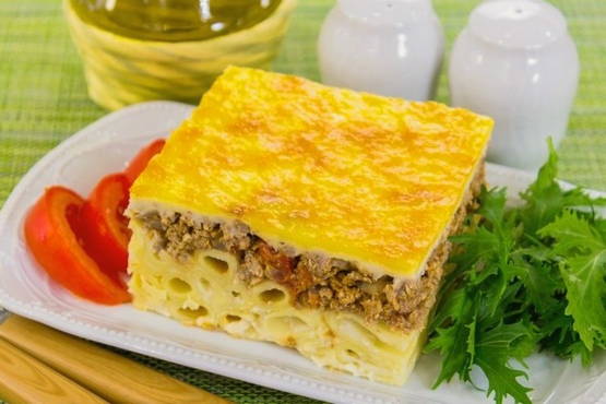 Pasta casserole with minced meat and cheese in the oven