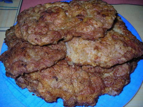 Pork neck chops in a pan