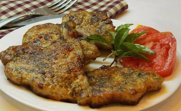Pork chops with mustard in a pan
