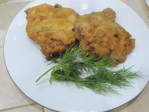 Pork chops in mayonnaise in a pan