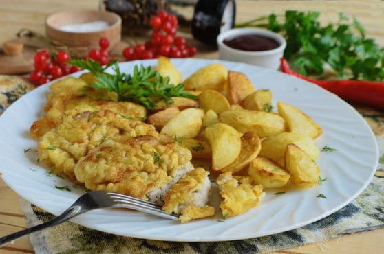 Pork chops in a pan in flour