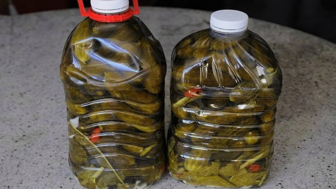 Pickled cucumbers in plastic bottles