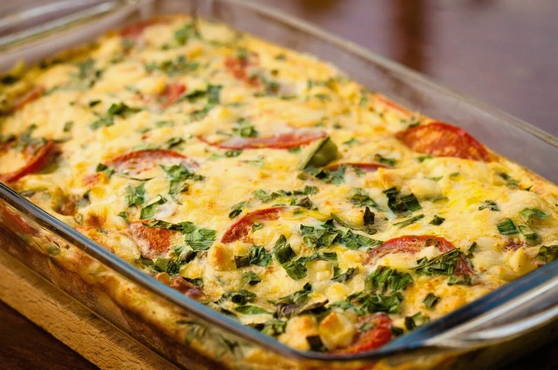 Zucchini casserole with minced potatoes and tomatoes