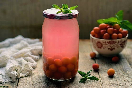 Red cherry plum compote for the winter