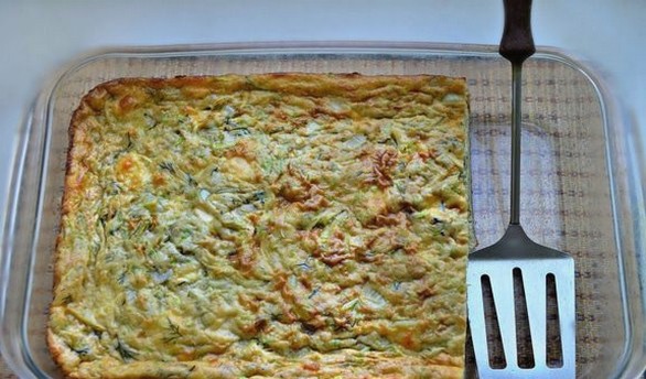 Zucchini casserole with feta cheese and herbs