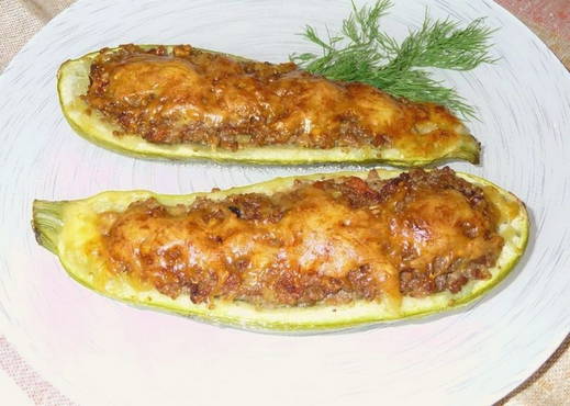 Zucchini boats with minced meat and cheese in the oven