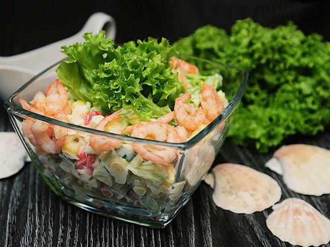 Shrimp salad with crab sticks and cheese