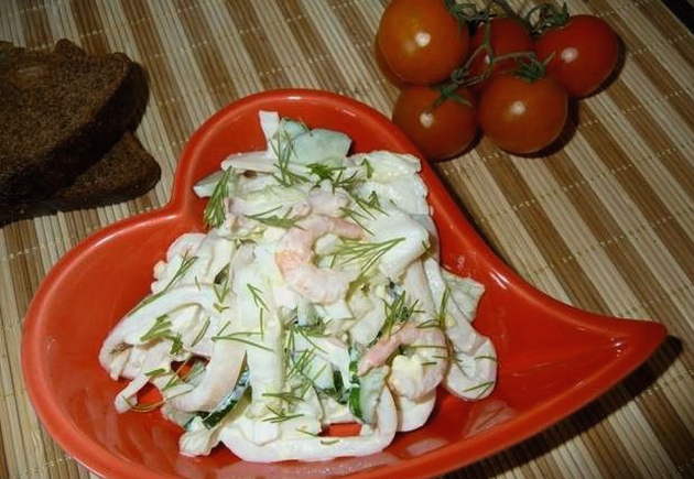 Salad with squid, shrimps, egg and cucumber