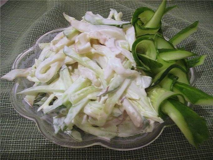 Salad with squid, egg, cucumber and onion