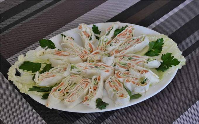 Lavash made from red fish, curd cheese and cucumber