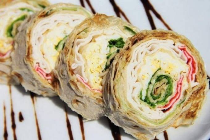 Lavash roll with crab sticks, egg, cucumber and cheese