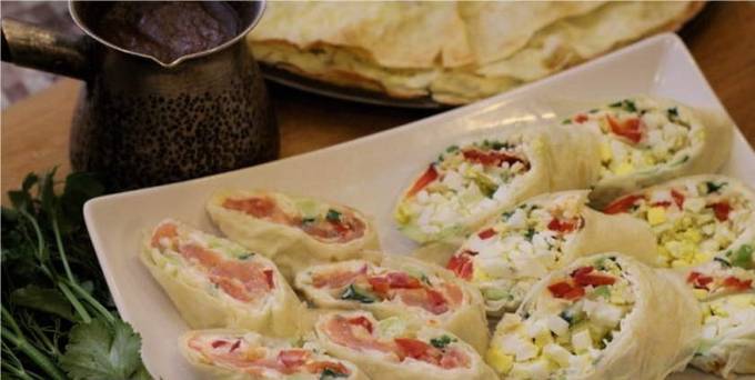 Lavash roll with egg, cucumber, cheese and garlic