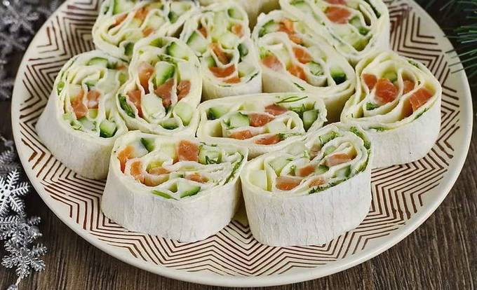 Lavash roll with red fish, melted cheese and cucumber