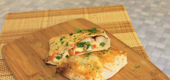 Lavash envelopes with chicken, tomatoes and cheese