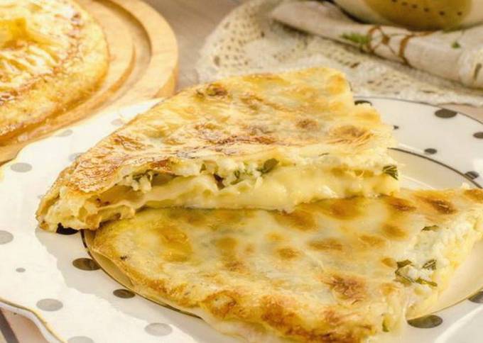 Lavash achma with cottage cheese and herbs