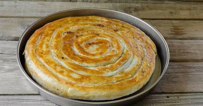 Lavash snail with minced meat in the oven