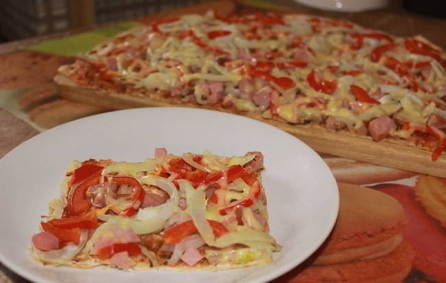 Armenian lavash pizza in the oven