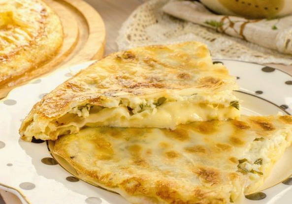 Lavash achma with cheese in a pan