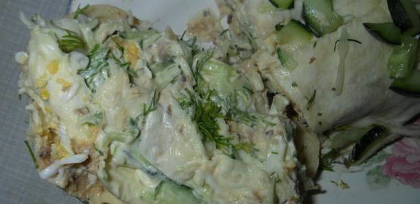 Lavash with canned fish, cheese and cucumber