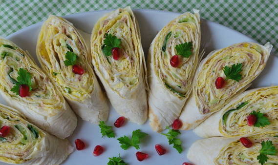 Lavash roll with canned fish, egg and cucumber