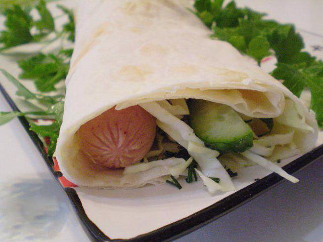 Sausage in pita bread with cabbage