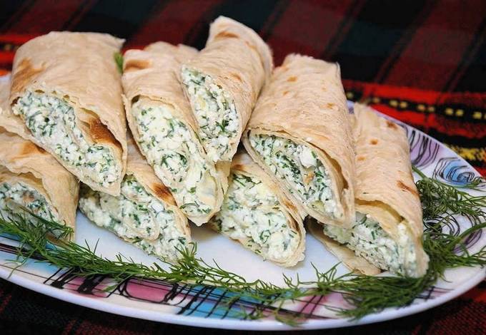 Lavash with cottage cheese, cheese and herbs