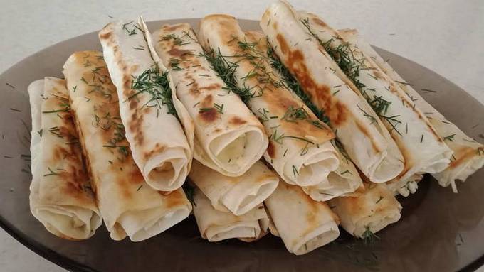 Lavash with cottage cheese, cheese in a pan
