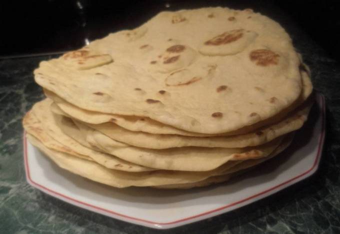 Thin pita bread without yeast in a pan at home