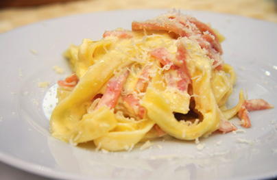 Pasta carbonara with ham, cream and cheese