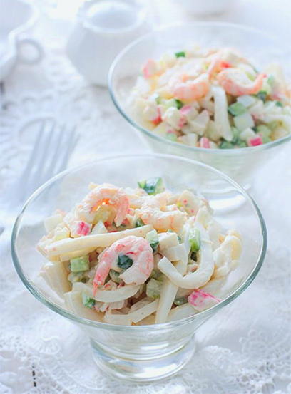 Shrimp, squid and crab sticks salad with cucumber