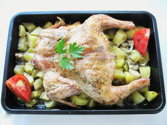 Chicken tabaka with vegetables in the oven