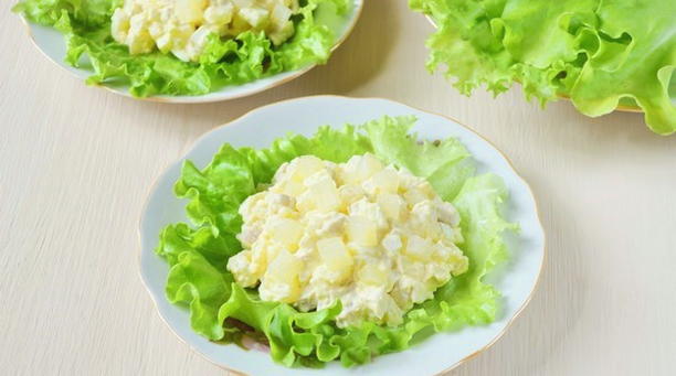 Salad with chicken, pineapple, cheese, garlic and mayonnaise