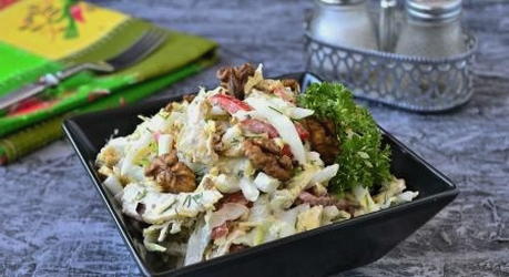 Chicken salad with cheese, walnuts and garlic