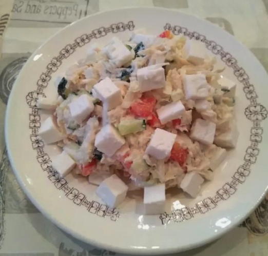 Salad with chicken, cheese, cucumber and Chinese cabbage