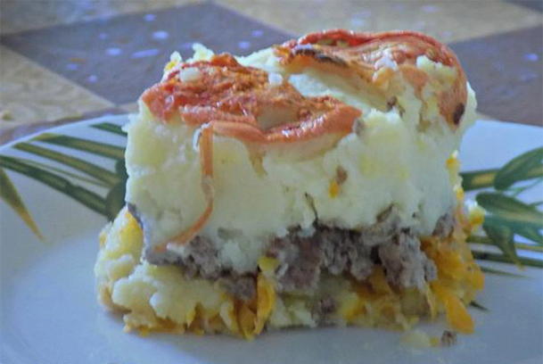 Casserole with mashed potatoes, minced meat and tomatoes