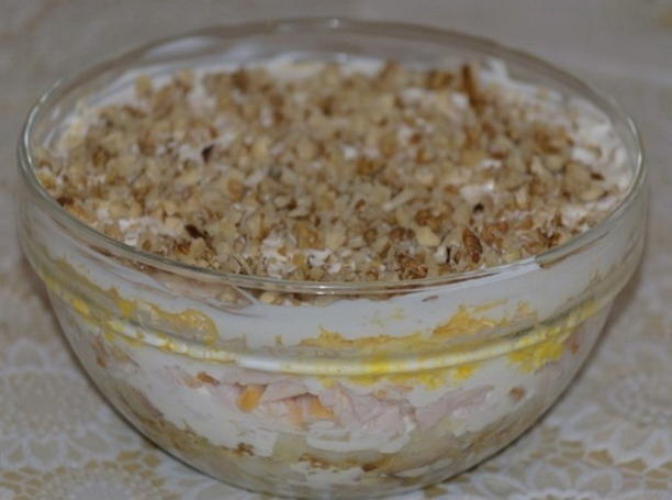 Salad with chicken, cheese, egg and walnuts