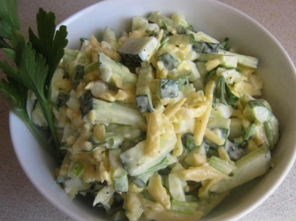 Salad with chicken, cheese, egg, cucumber and mayonnaise