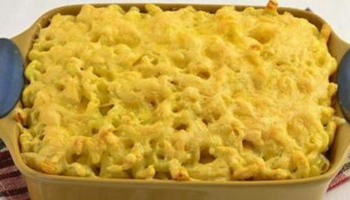 Pasta casserole with sausage, cheese and eggs in the oven