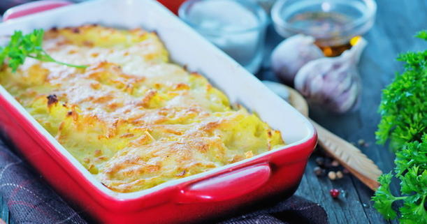 Potato casserole with minced meat and zucchini in the oven