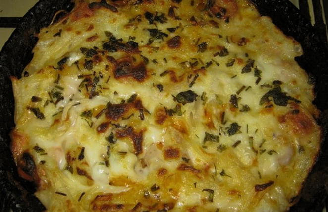 Pasta casserole with sausages and cheese in the oven