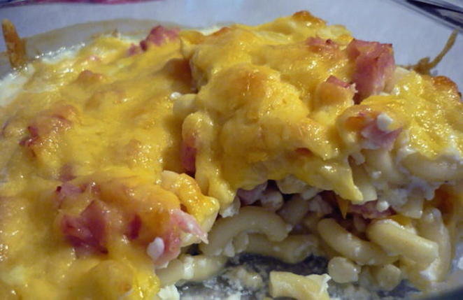 Casserole with pasta, ham and cheese in the oven
