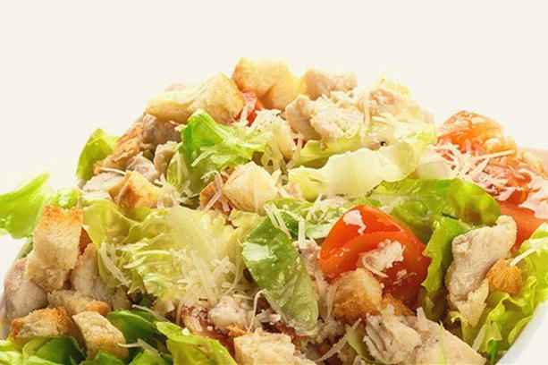 Caesar salad with chicken, croutons, tomatoes and mayonnaise classic