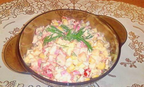 Salad with crab sticks, corn, cheese and tomatoes