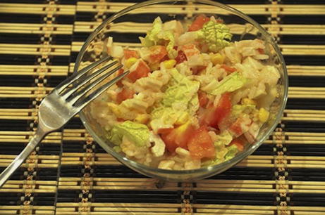 Salad with crab sticks, corn, rice and tomatoes