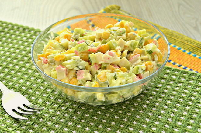 Salad with crab sticks, corn, cucumber and croutons