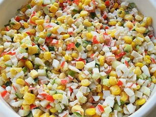 Crab salad with corn, cucumber and croutons