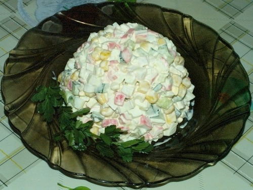 Salad with crab sticks, cucumber, egg and mayonnaise