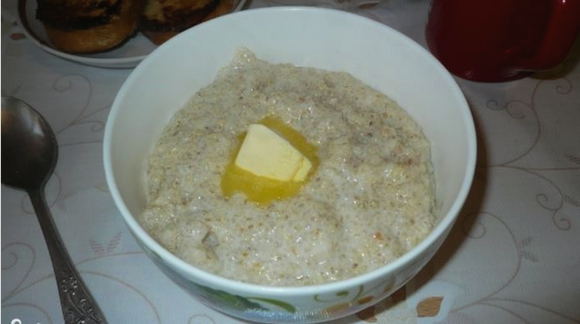 Barley porridge with milk for a child